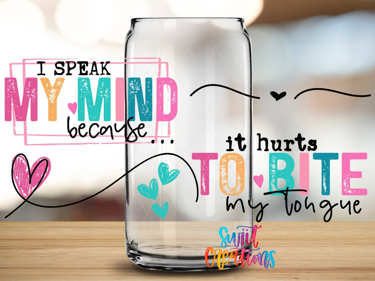 Close-up of the I Speak My Mind UV DTF wrap on a clear glass can