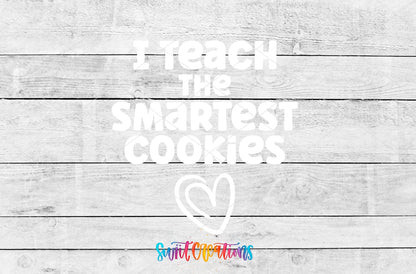 I Teach the Smartest Cookies UV DTF transfer artwork on a gray wood background