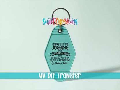 I Wanted to Go Jogging UV DTF transfer on a teal motel keychain on a mint background