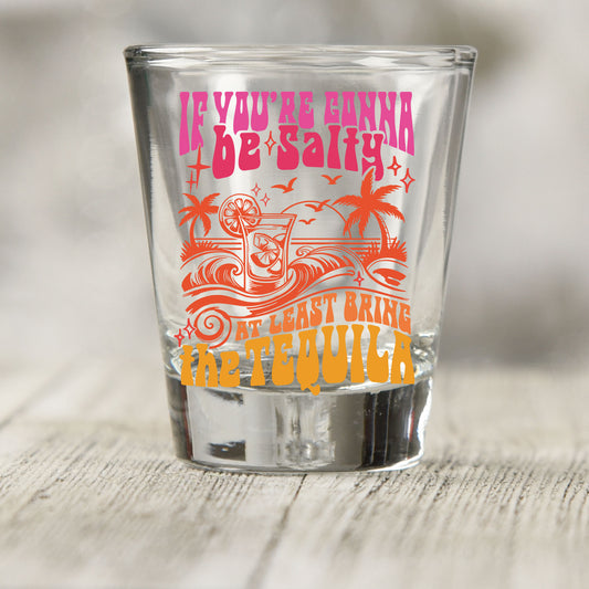 If You're Gonna Be Salty shot glass UV DTF transfer with tropical drink, palm trees, and wave details on a clear shot glass