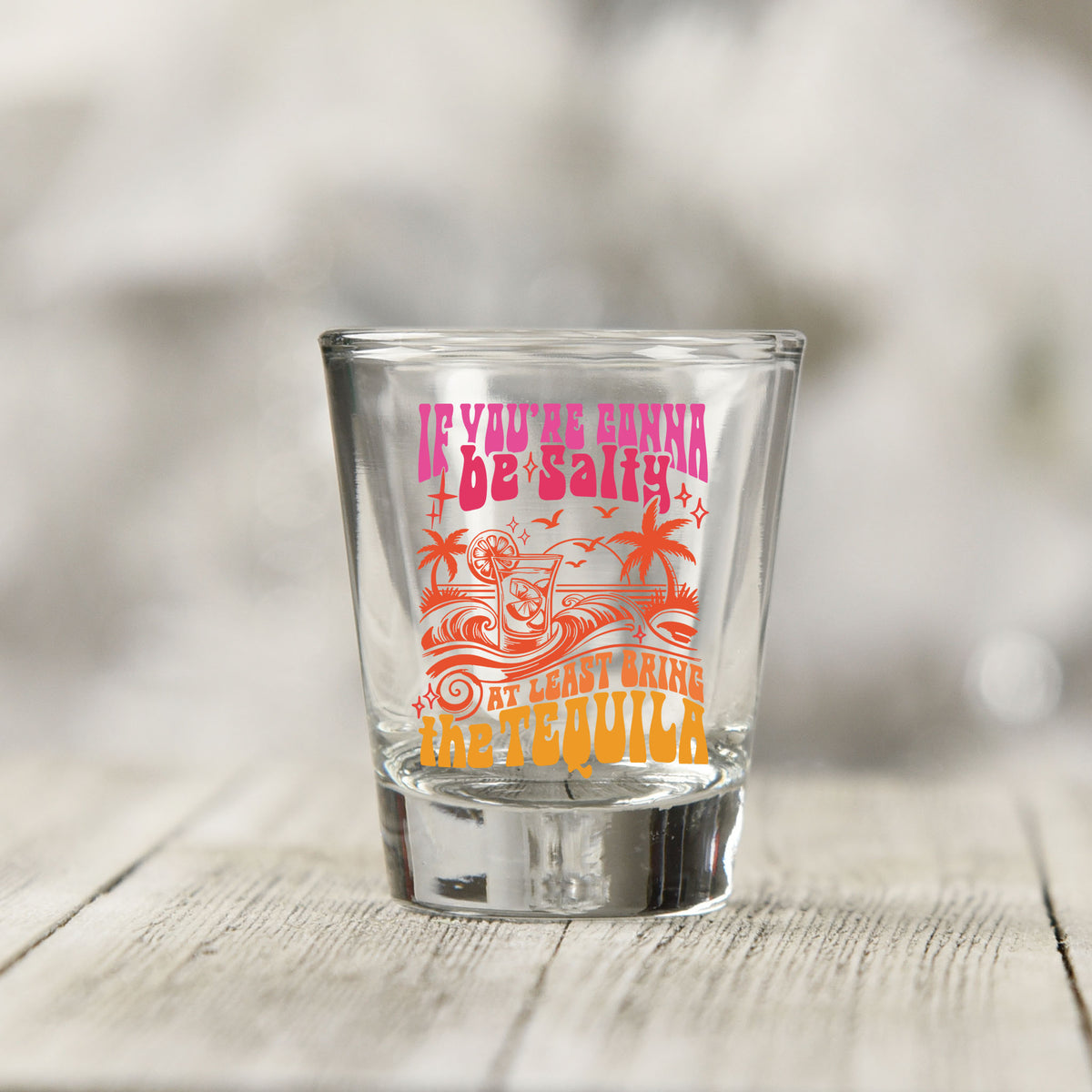 Close-up of the If You're Gonna Be Salty UV DTF transfer on a clear shot glass