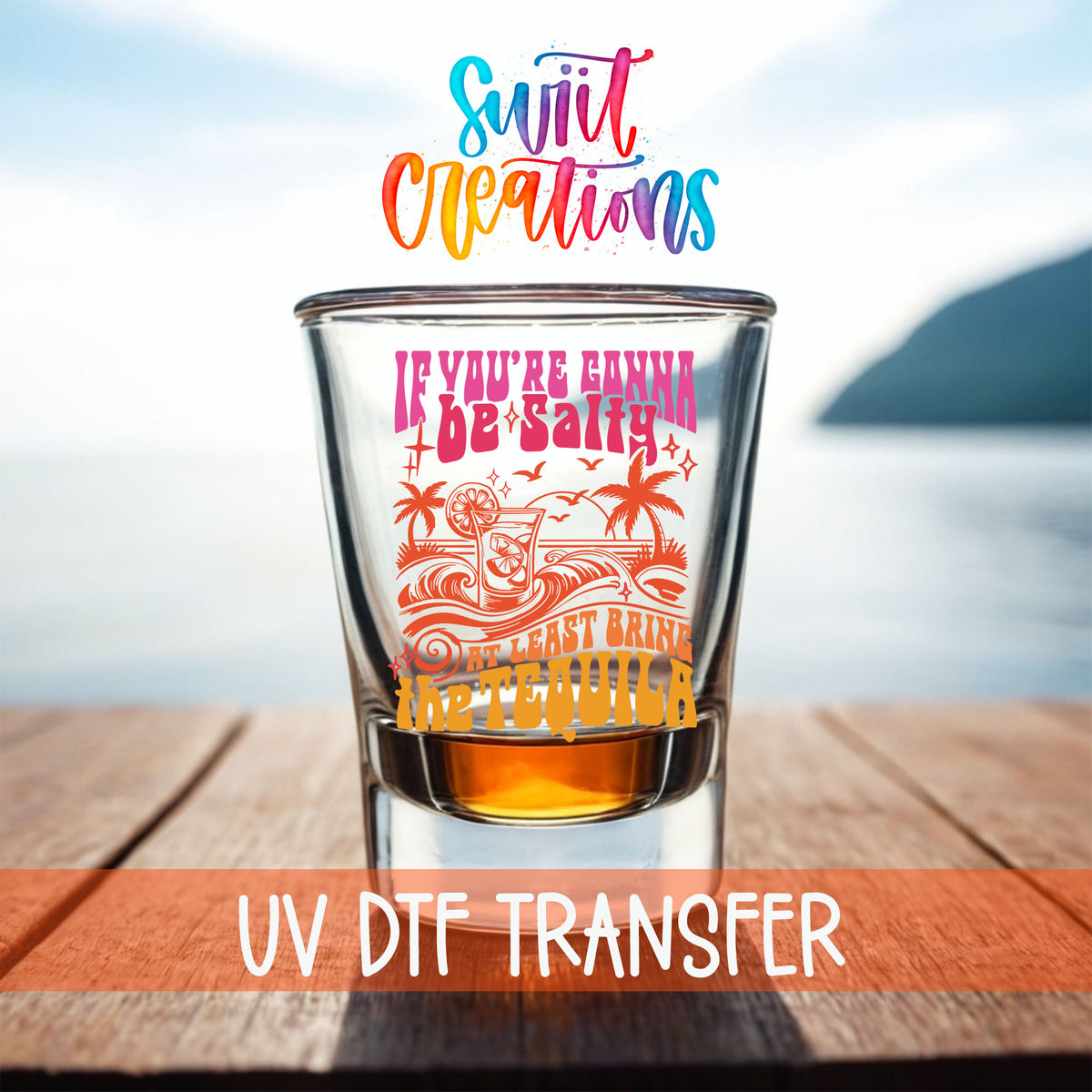If You're Gonna Be Salty shot glass UV DTF transfer on a filled shot glass on a dock by the water