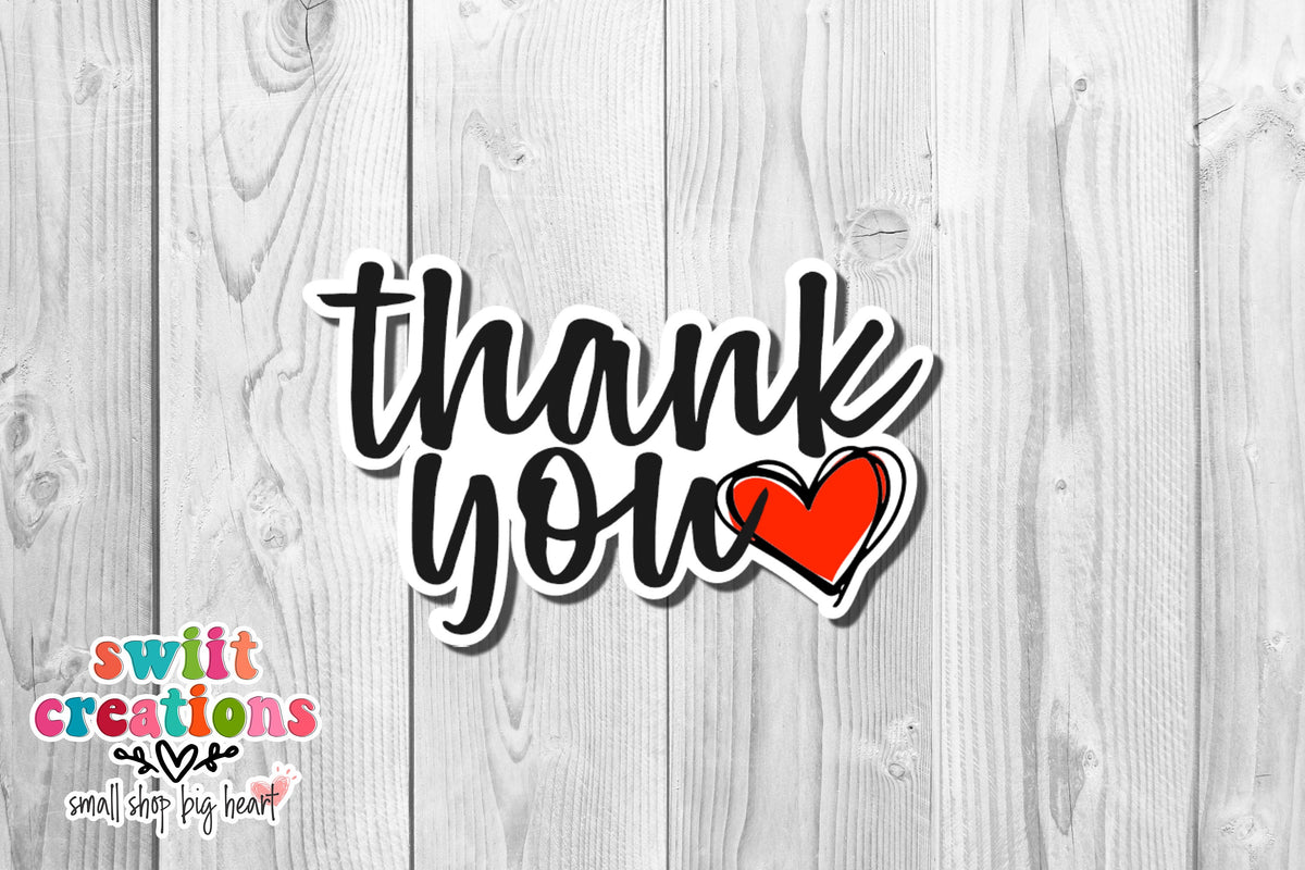 Thank you sticker with red heart from the sample sheet on white wood