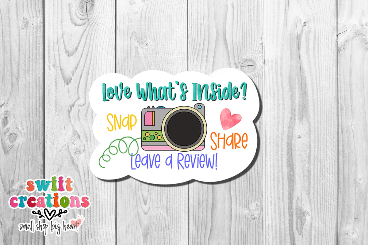 Love what's inside snap share camera sticker on white wood