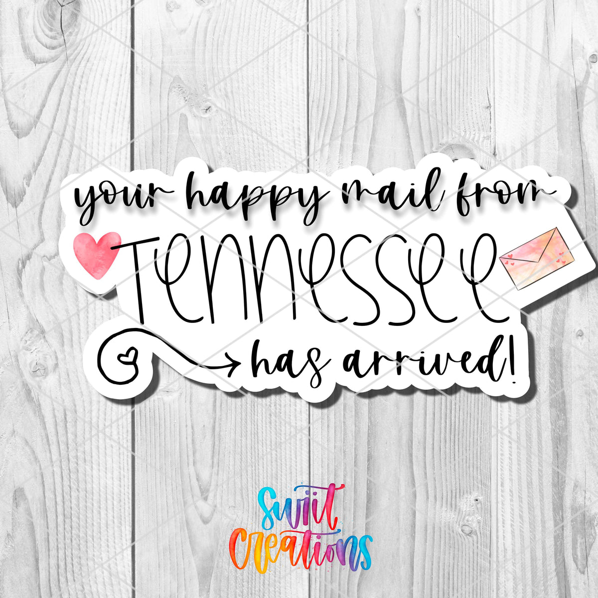Close-up of happy mail from Tennessee sticker on white wood