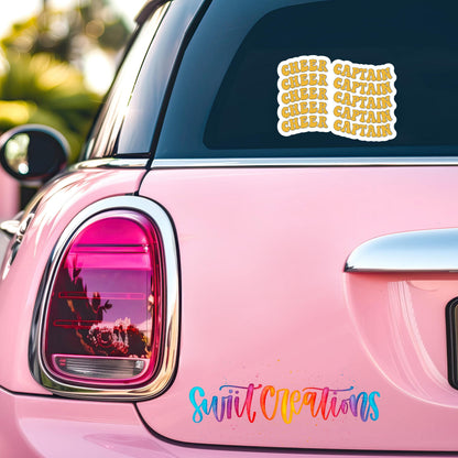 Gold Retro Cheer Captain sticker on the back window of a pink car