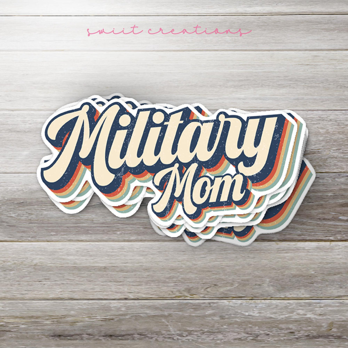 Stack of Retro Military Mom glossy stickers on a gray wood table