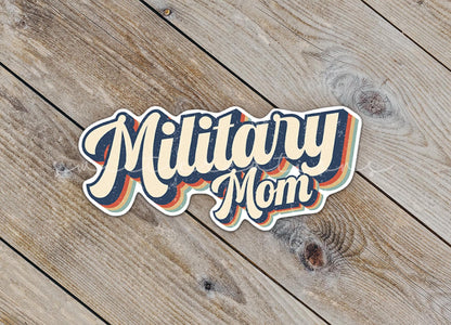 Close-up of the Retro Military Mom sticker on rustic wood