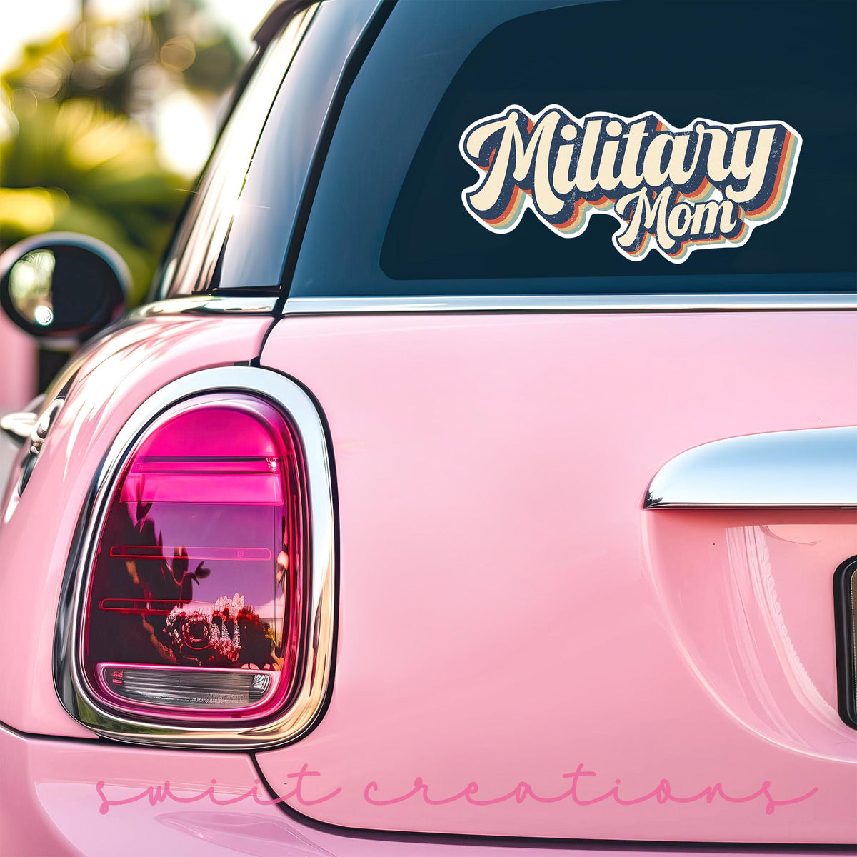 Retro Military Mom sticker on the back window of a pink car