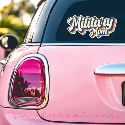 Retro Military Mom sticker on the back window of a pink car