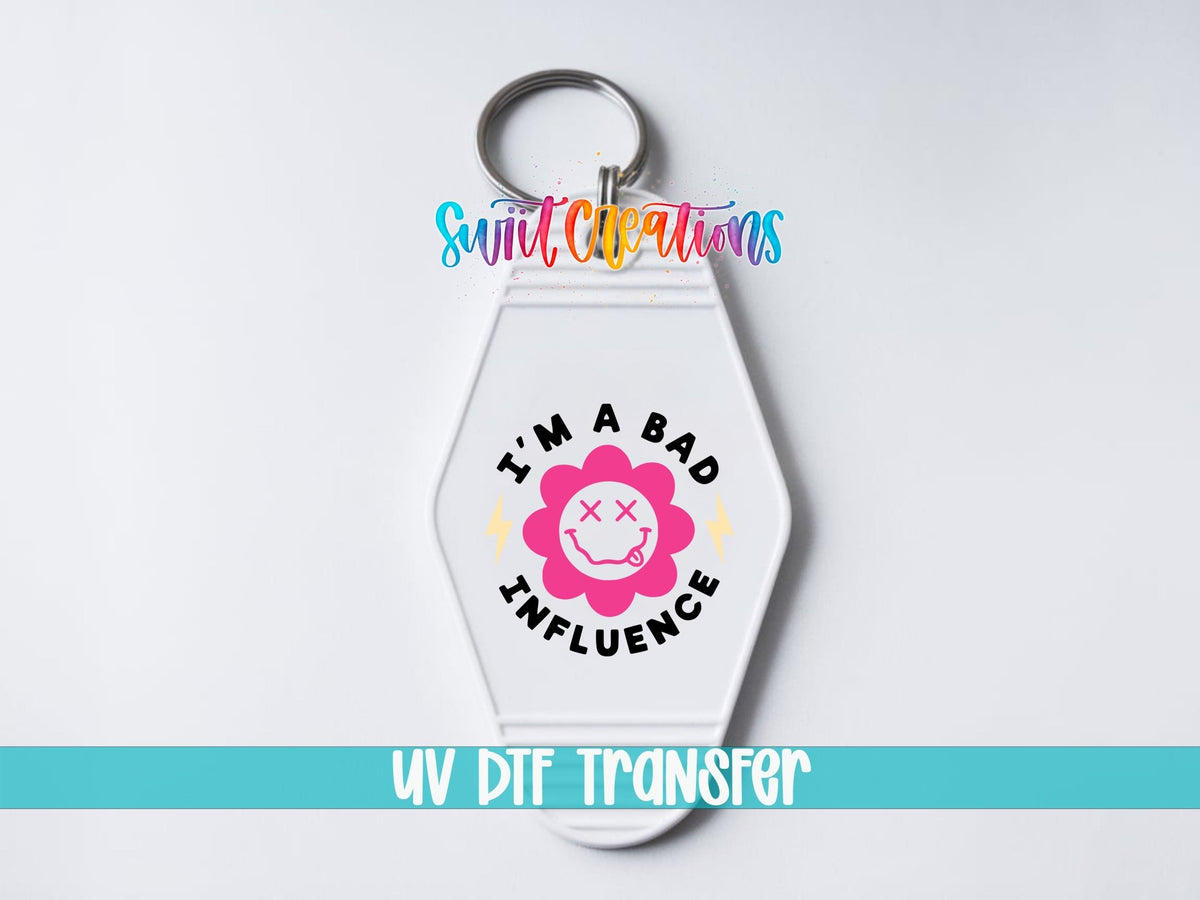 I'm a Bad Influence UV DTF transfer on a white motel keychain on a white background