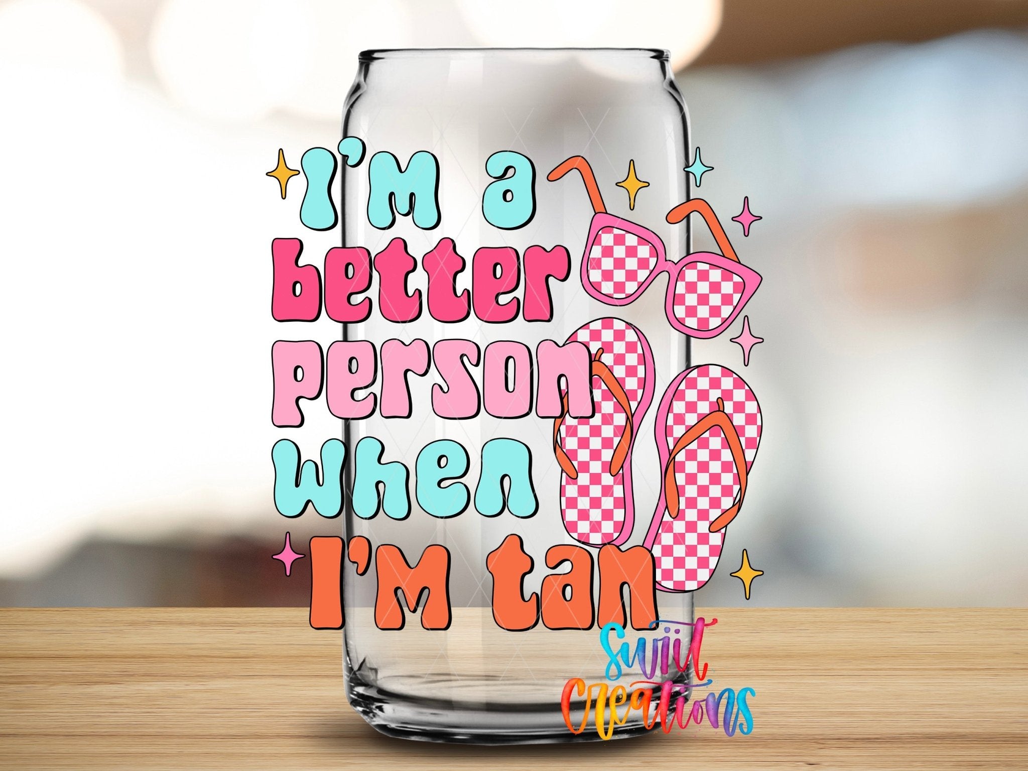 I’m a Better Person When I’m Tan UV DTF transfer applied to a clear glass can from Swiit Creations