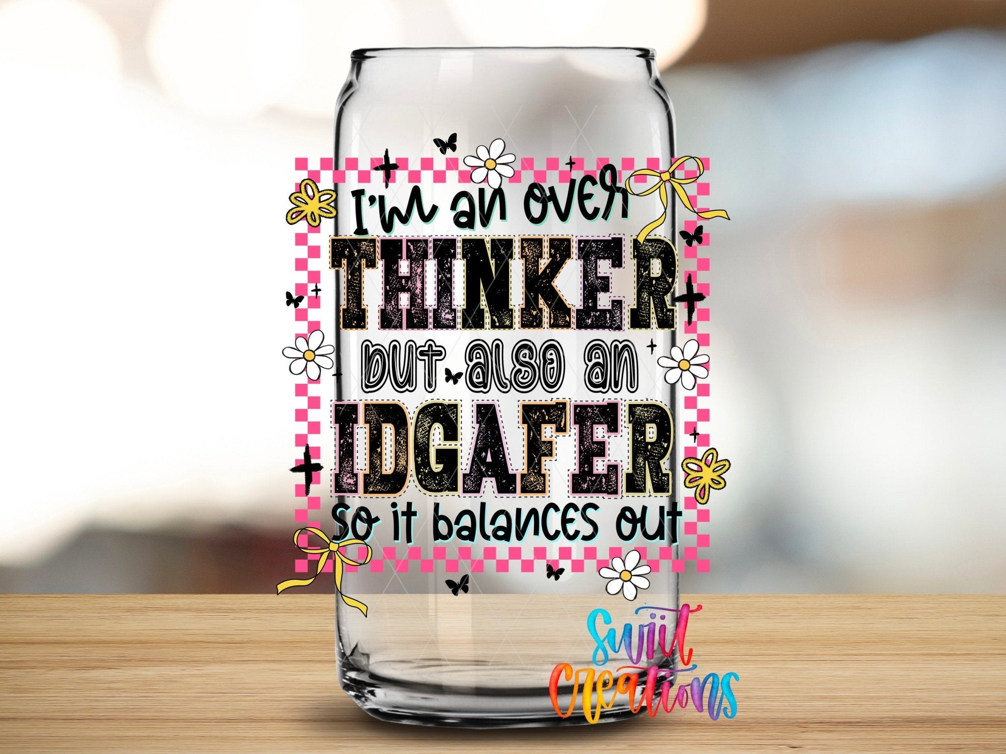 I’m An Over Thinker But Also An IDGAFer UV DTF transfer applied to a clear glass can from Swiit Creations