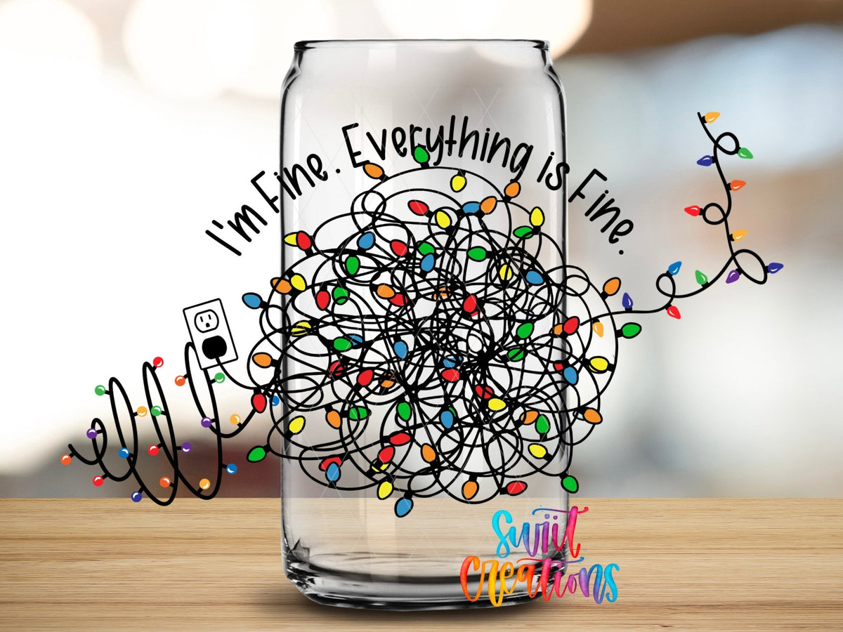 Close-up of the I'm Fine Everything Is Fine UV DTF wrap on a clear glass can