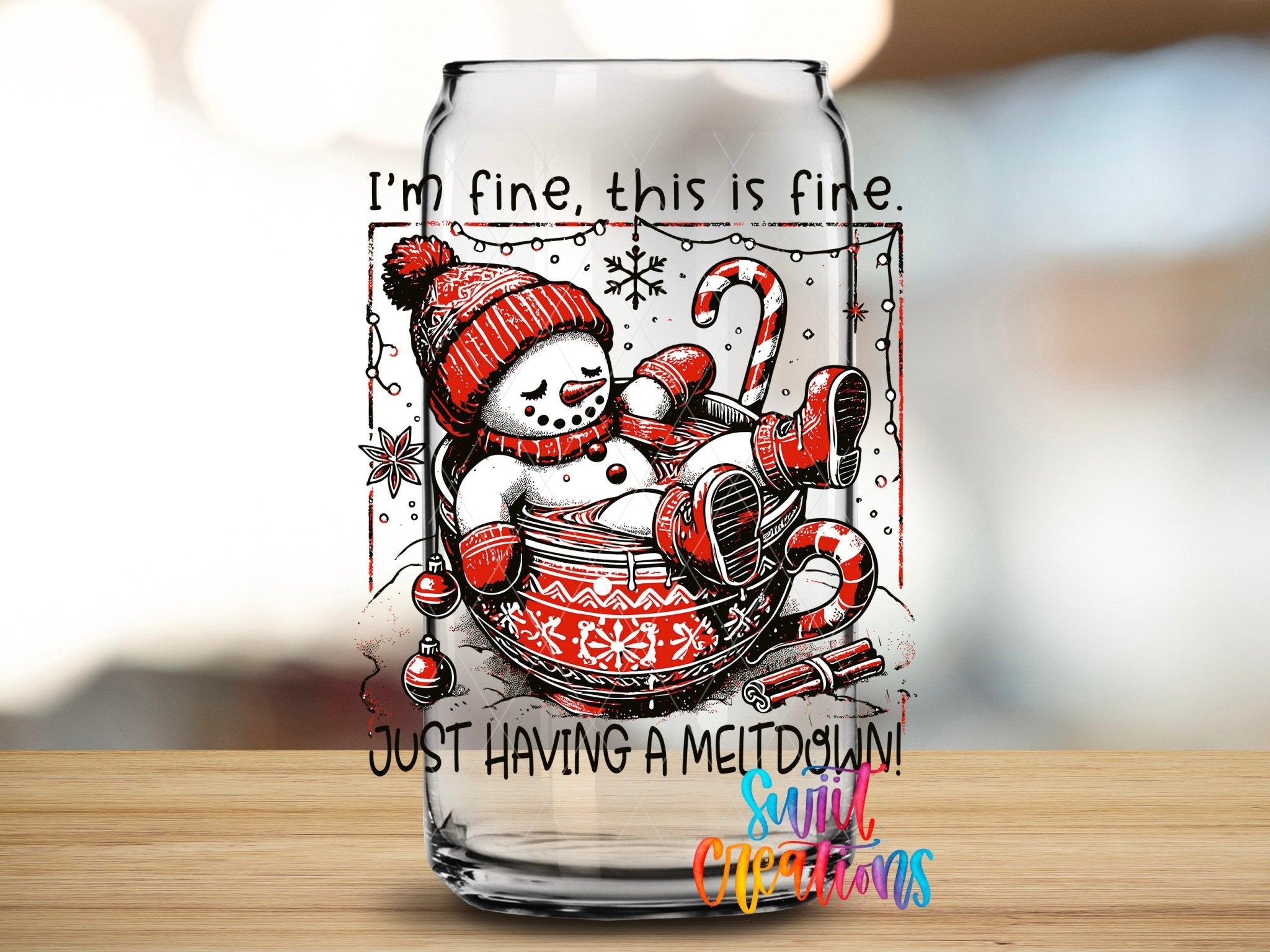 Swiit Creations UV DTF Snowman Having a Meltdown transfer applied to a clear glass can
