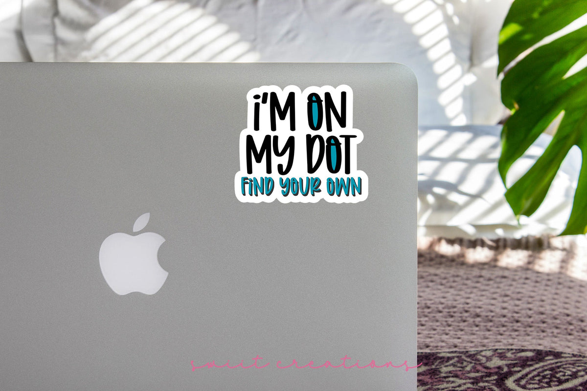 I'm On My Dot sticker on the lid of a silver laptop