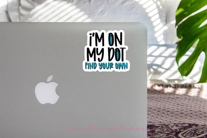 I'm On My Dot sticker on the lid of a silver laptop