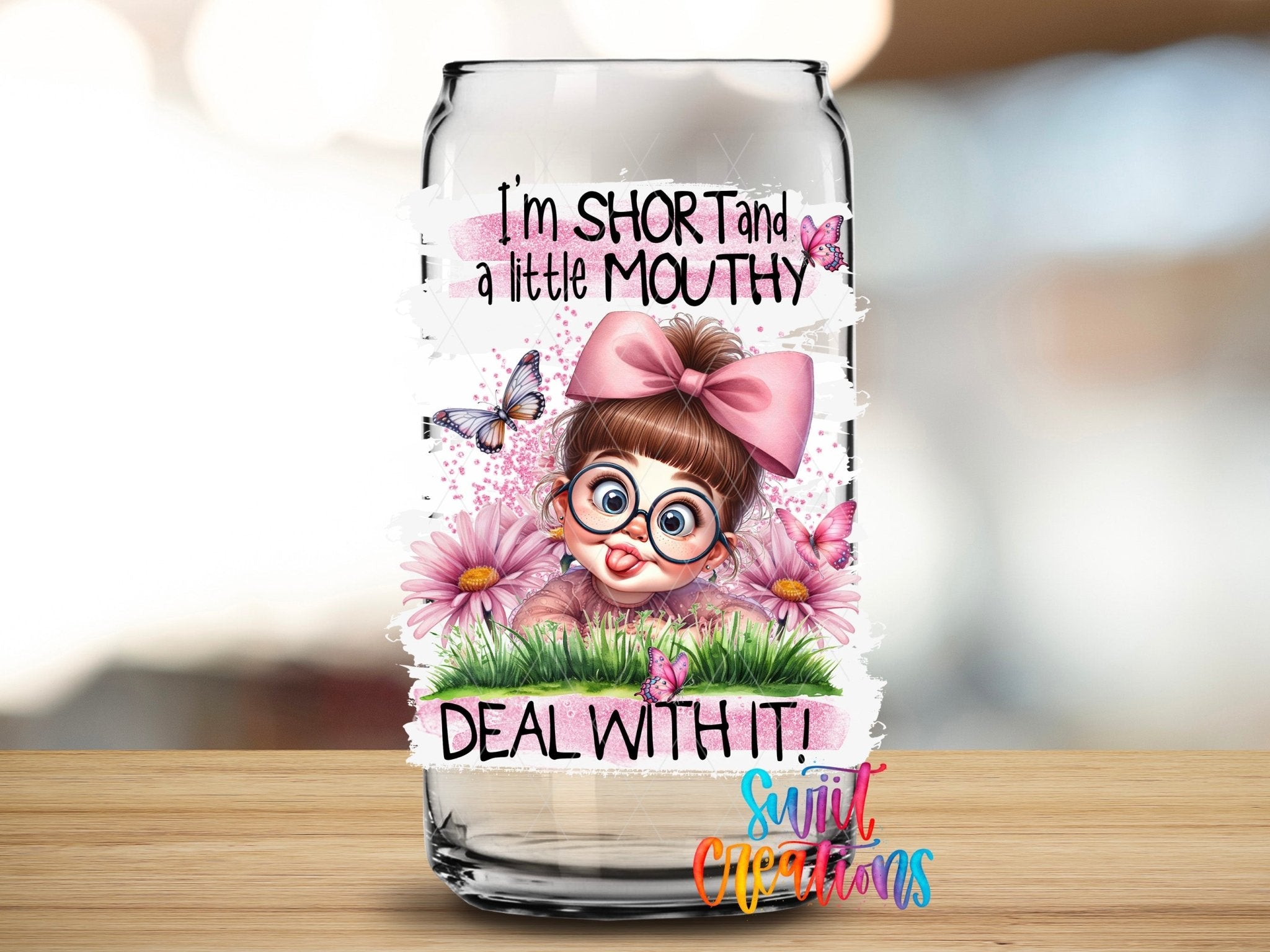 I'm Short and a Little Mouthy Deal With It UV DTF transfer applied to a clear glass can from Swiit Creations