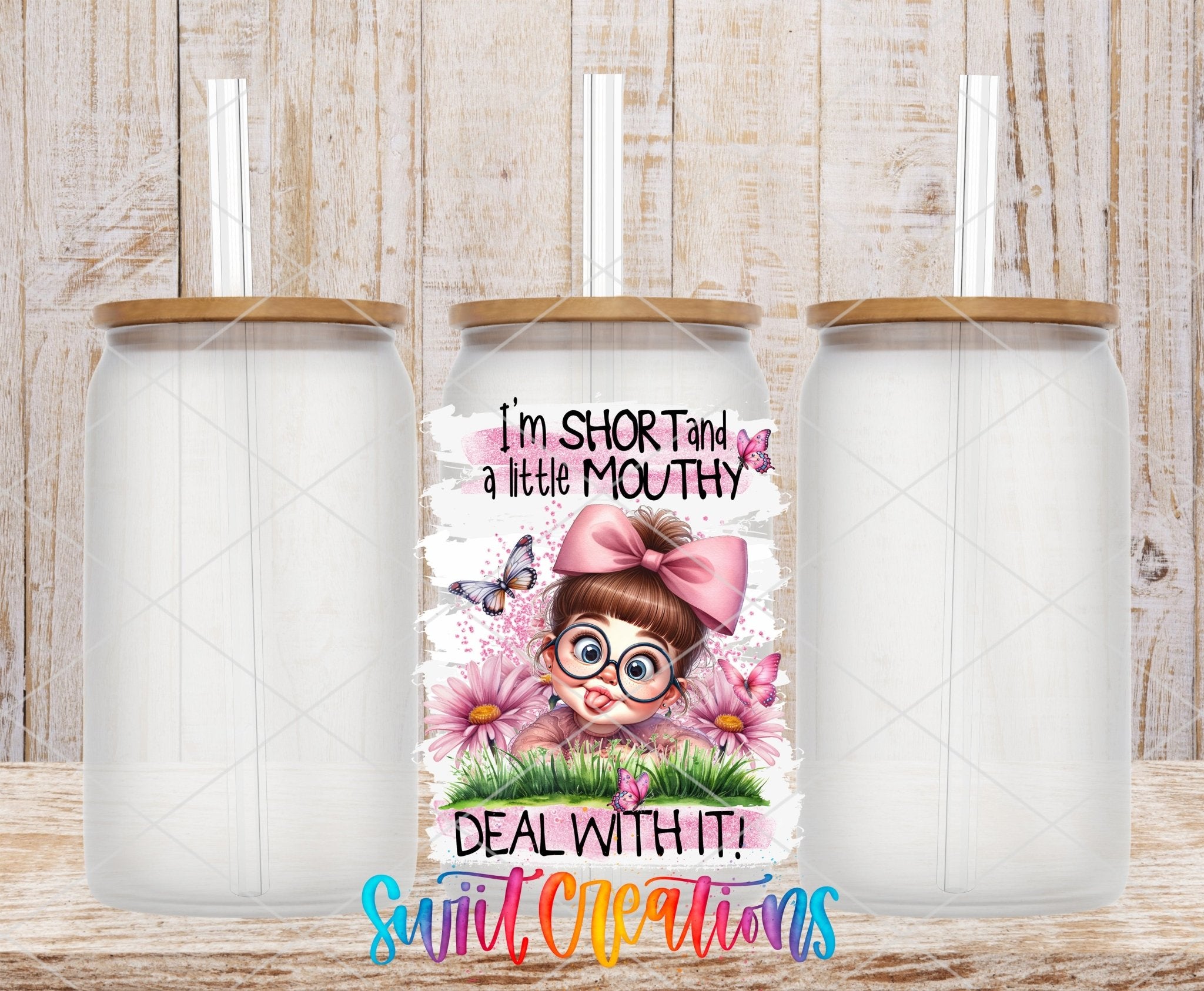 I'm Short and a Little Mouthy Deal With It UV DTF transfer applied to a clear glass can set from Swiit Creations