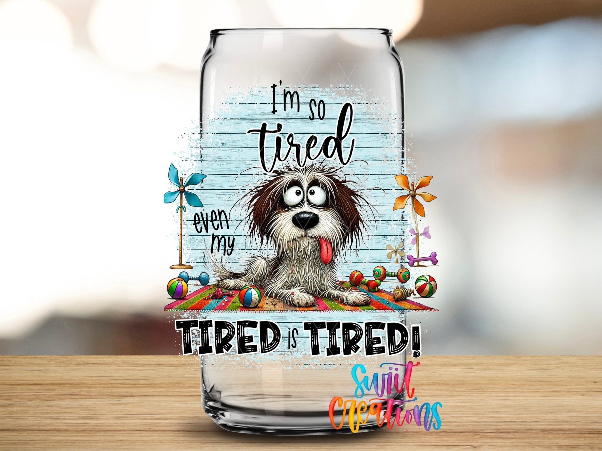 Swiit Creations UV DTF Even My Tired Is Tired transfer applied to a clear glass can