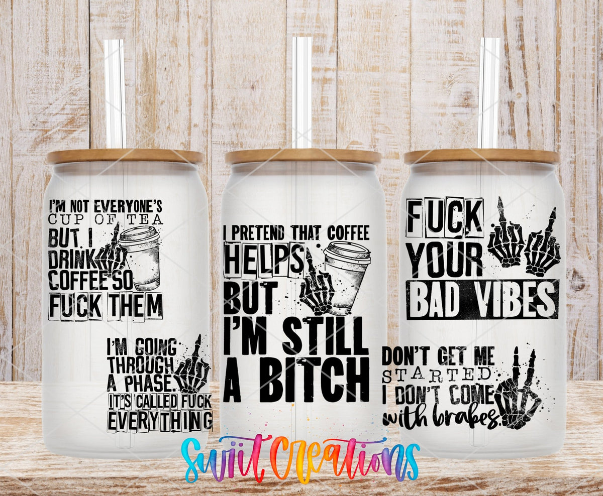 I'm Still a B*tch UV DTF full wrap on three clear glass cans with bamboo lids