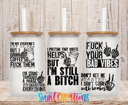 I'm Still a B*tch UV DTF full wrap on three clear glass cans with bamboo lids