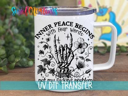 Inner Peace Begins With Four Words black skeleton hand UV DTF transfer on a white stainless steel mug with a lid