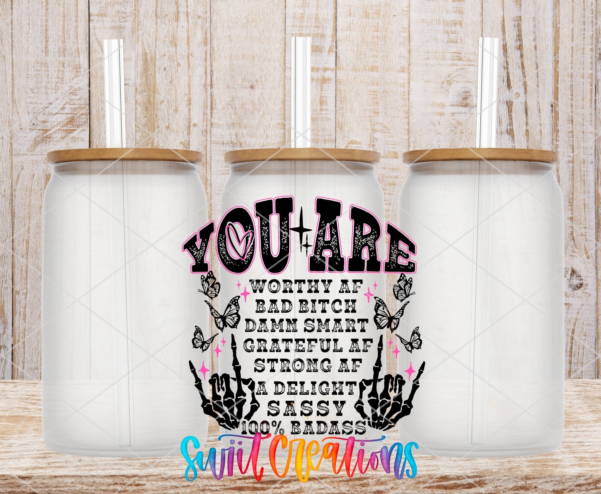 Inspirational You Are a Badass UV DTF transfer applied to a clear glass can set from Swiit Creations