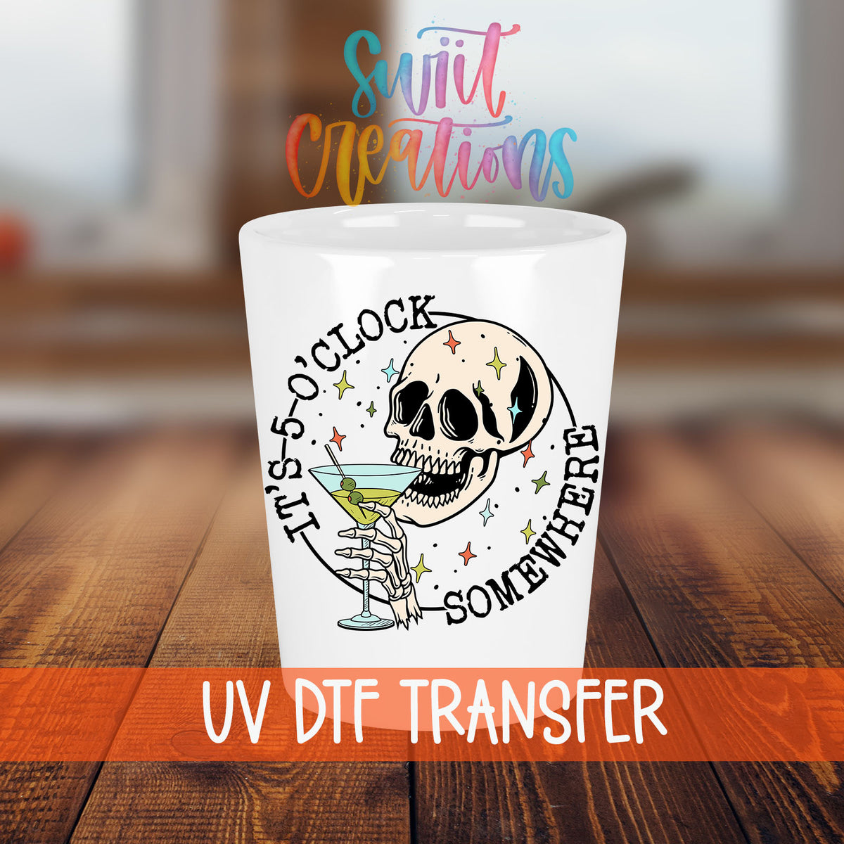 It's 5 O'Clock Somewhere shot glass transfer on a white shot glass on a wooden table