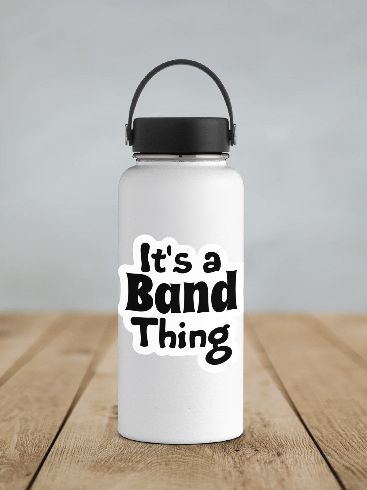 Black It's a Band Thing sticker on a white insulated water bottle