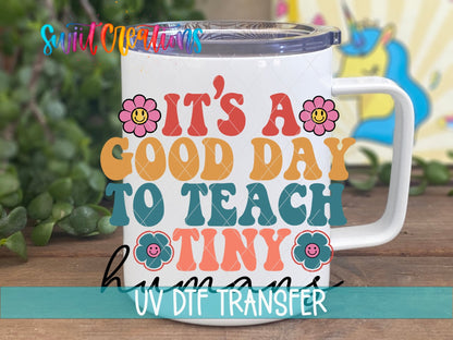 It's a Good Day to Teach Tiny Humans retro flowers UV DTF transfer on a white stainless steel mug with a lid