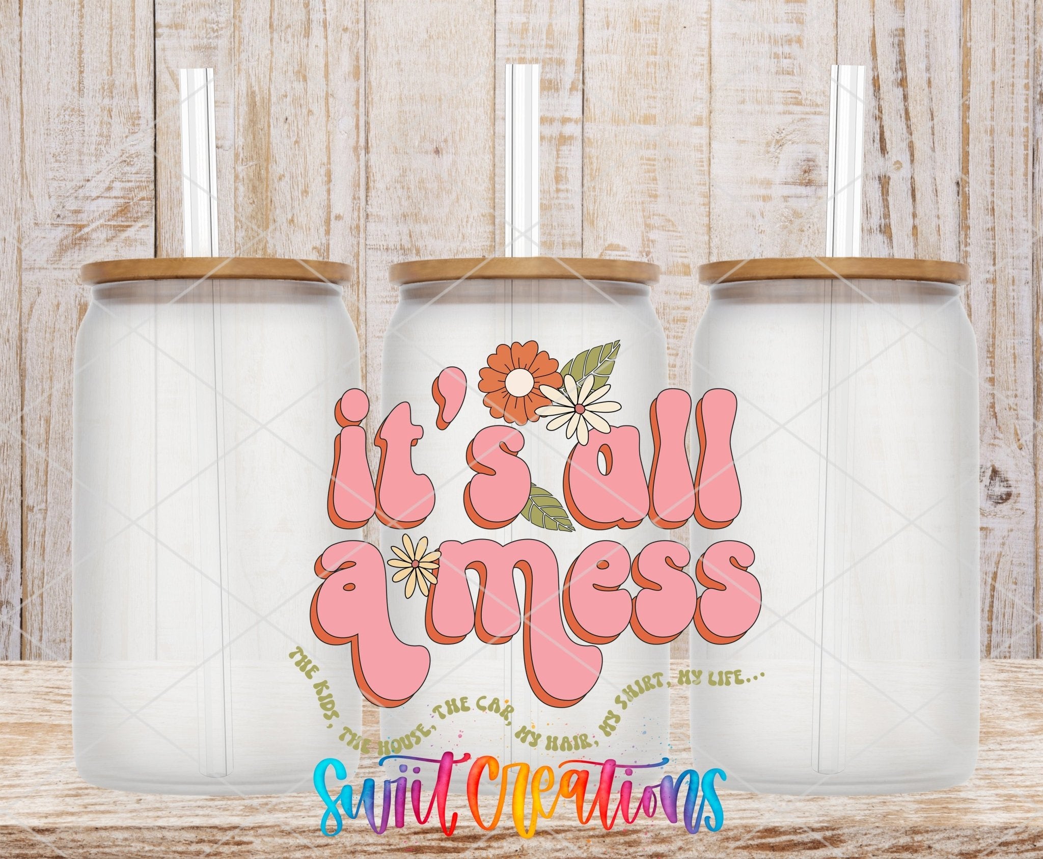 It’s All a Mess UV DTF transfer applied to a clear glass can set from Swiit Creations