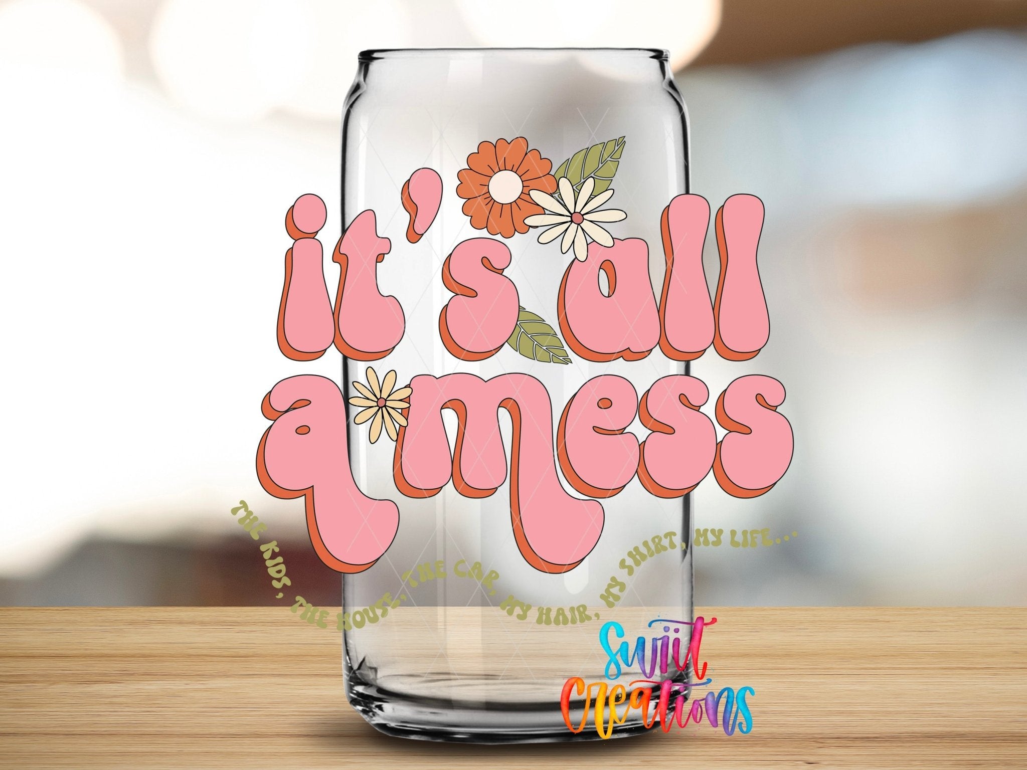 It’s All a Mess UV DTF transfer applied to a clear glass can from Swiit Creations