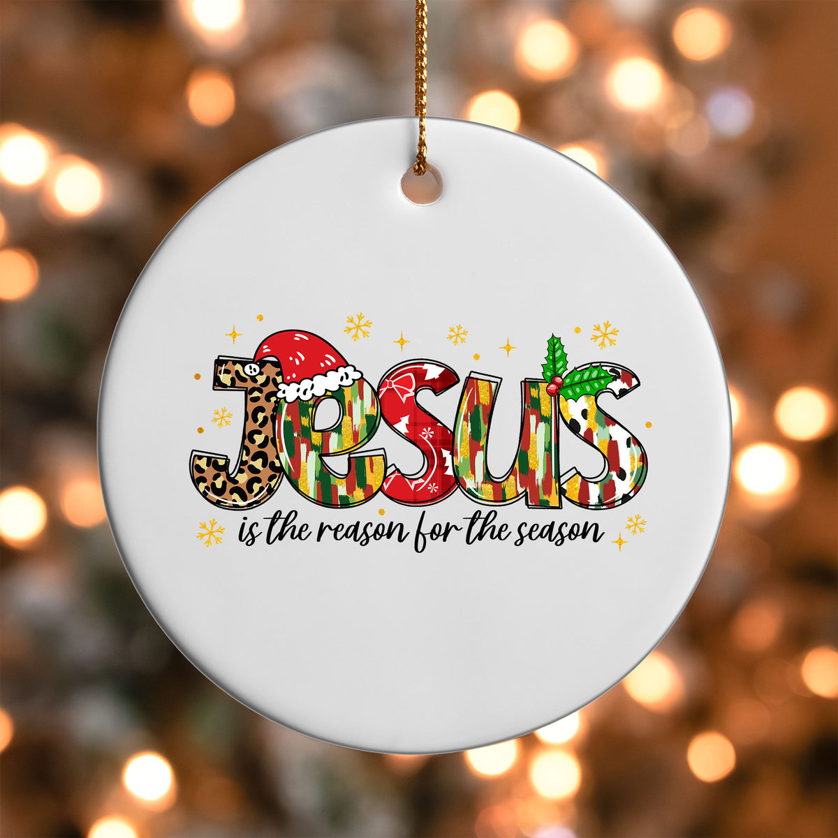 Jesus Is the Reason for the Season ornament UV DTF transfer on a round white ornament with a bokeh light background