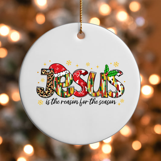 Jesus Is the Reason for the Season ornament UV DTF transfer on a round white ornament with a bokeh light background