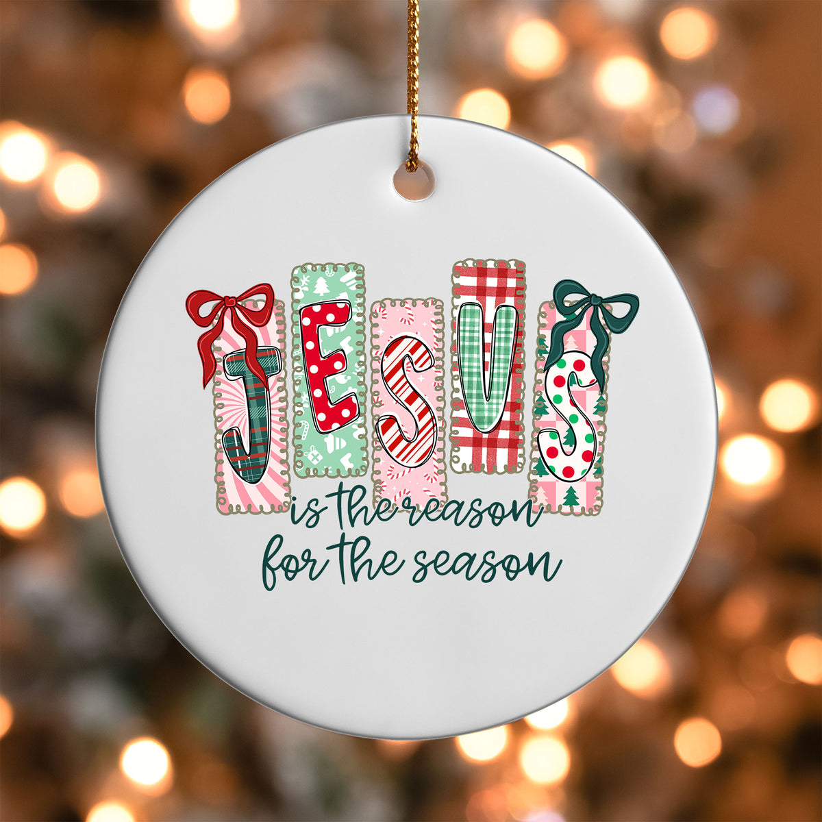 Jesus Is the Reason for the Season ornament UV DTF transfer on a round white ornament with a bokeh light background