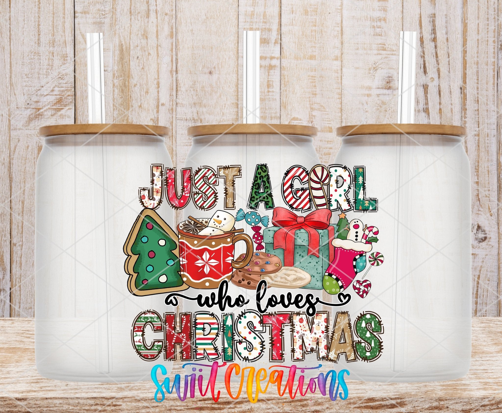 Just a Girl Who Loves Christmas UV DTF transfer applied to a clear glass can set from Swiit Creations