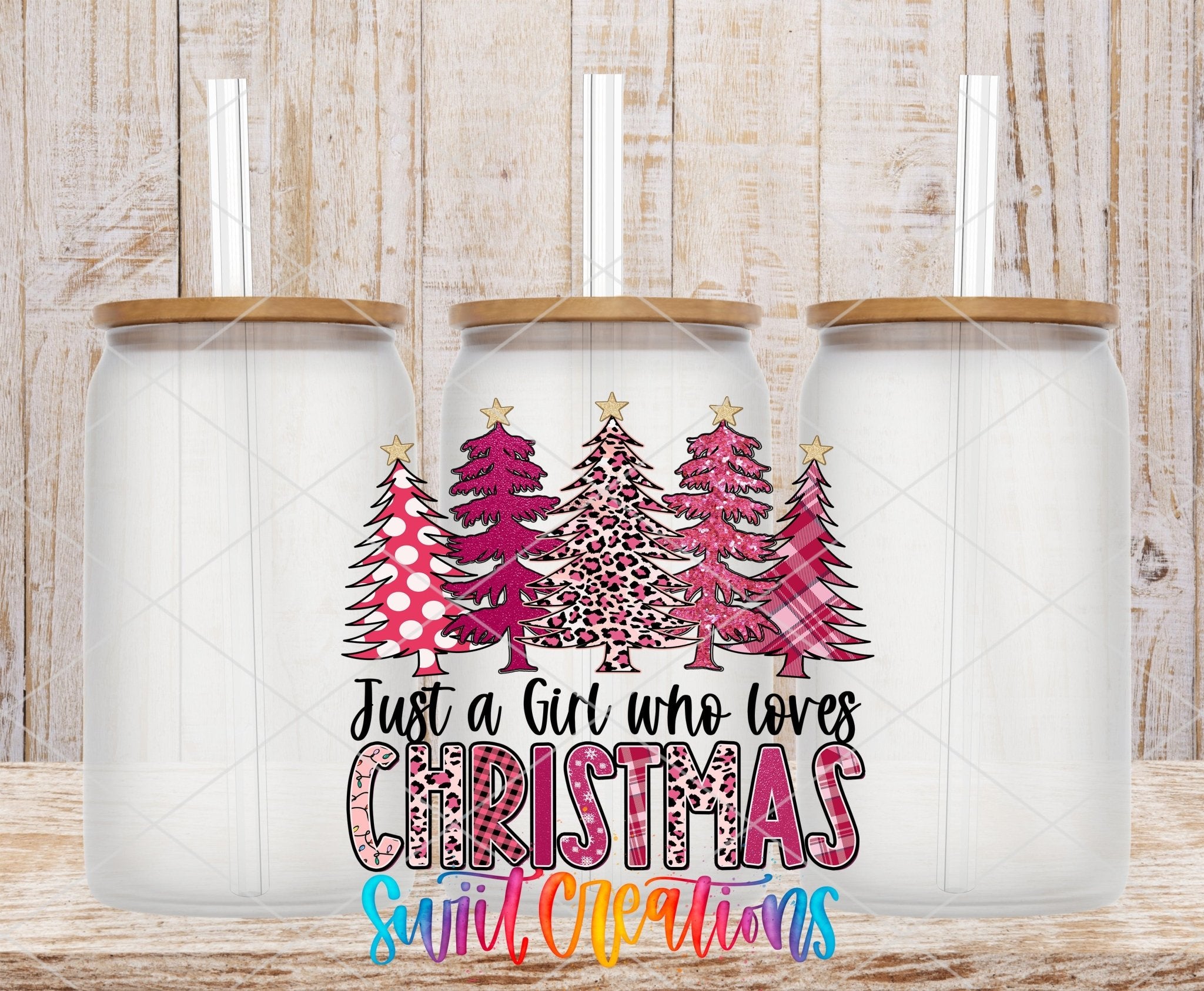 Just a Girl Who Loves Christmas UV DTF transfer applied to a clear glass can set from Swiit Creations