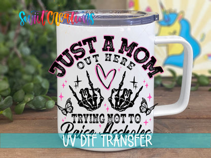 Just a Mom Out Here UV DTF transfer on a white stainless steel mug with a lid