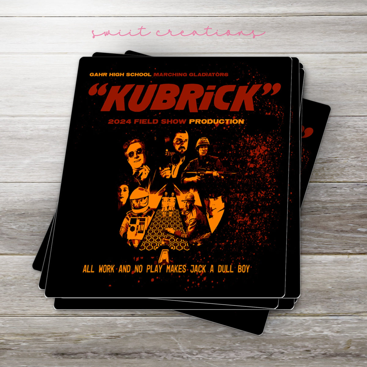 Stack of Gahr Kubrick 2024 glossy stickers on a gray wood table