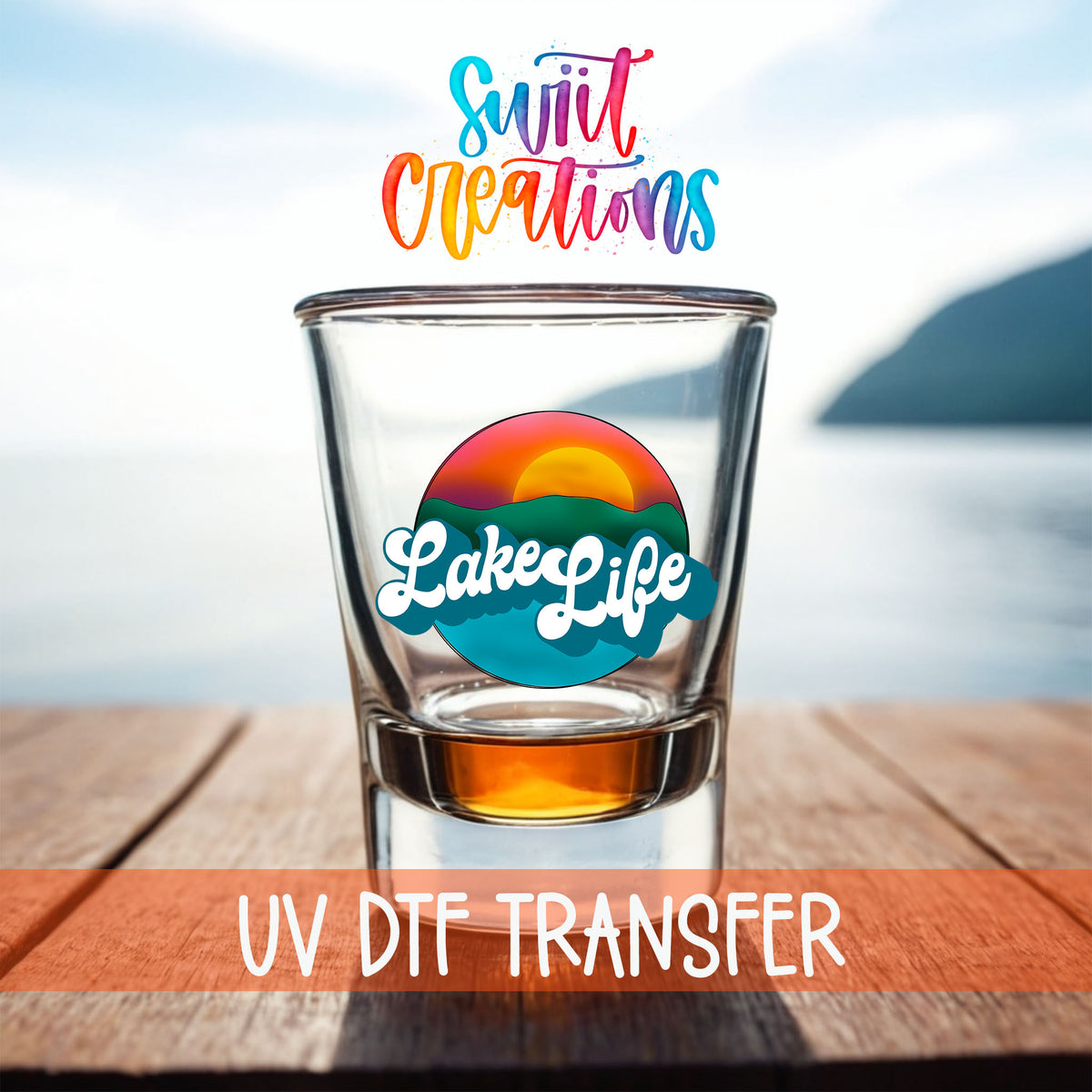 Lake Life shot glass UV DTF transfer on a filled shot glass on a dock by the water
