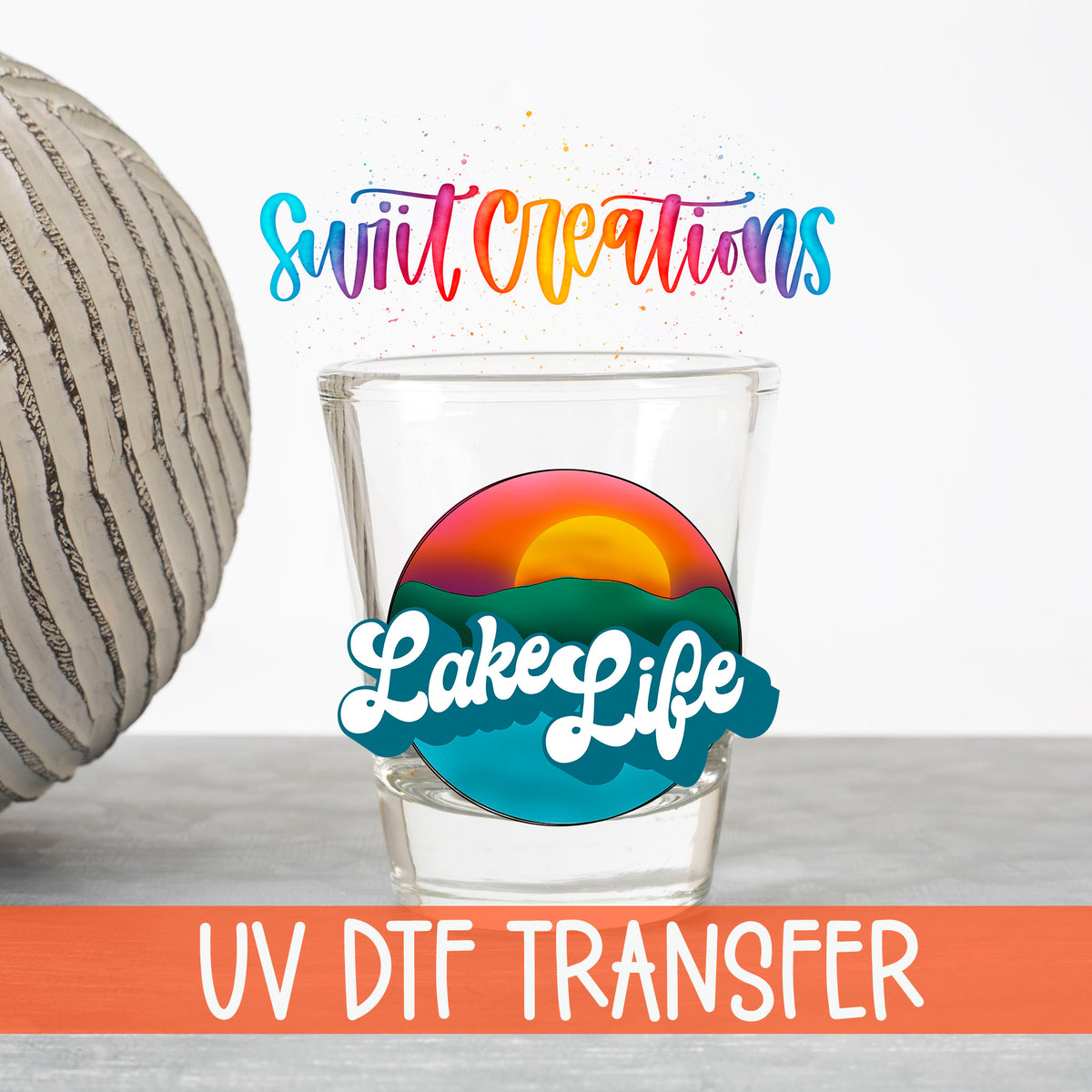 Lake Life UV DTF transfer on a clear shot glass with the Swiit Creations logo and UV DTF Transfer banner
