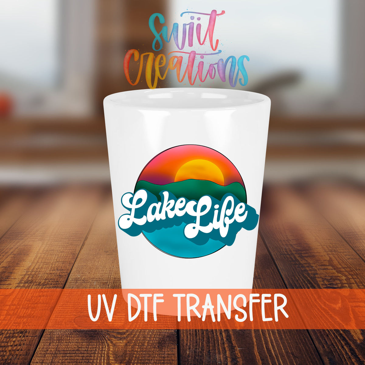 Lake Life shot glass transfer on a white shot glass on a wooden table