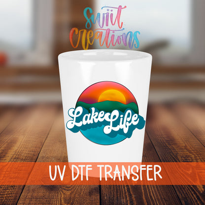 Lake Life shot glass transfer on a white shot glass on a wooden table