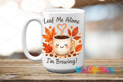 Leaf Me Alone Fall Coffee UV DTF transfer displayed on a white ceramic mug from Swiit Creations