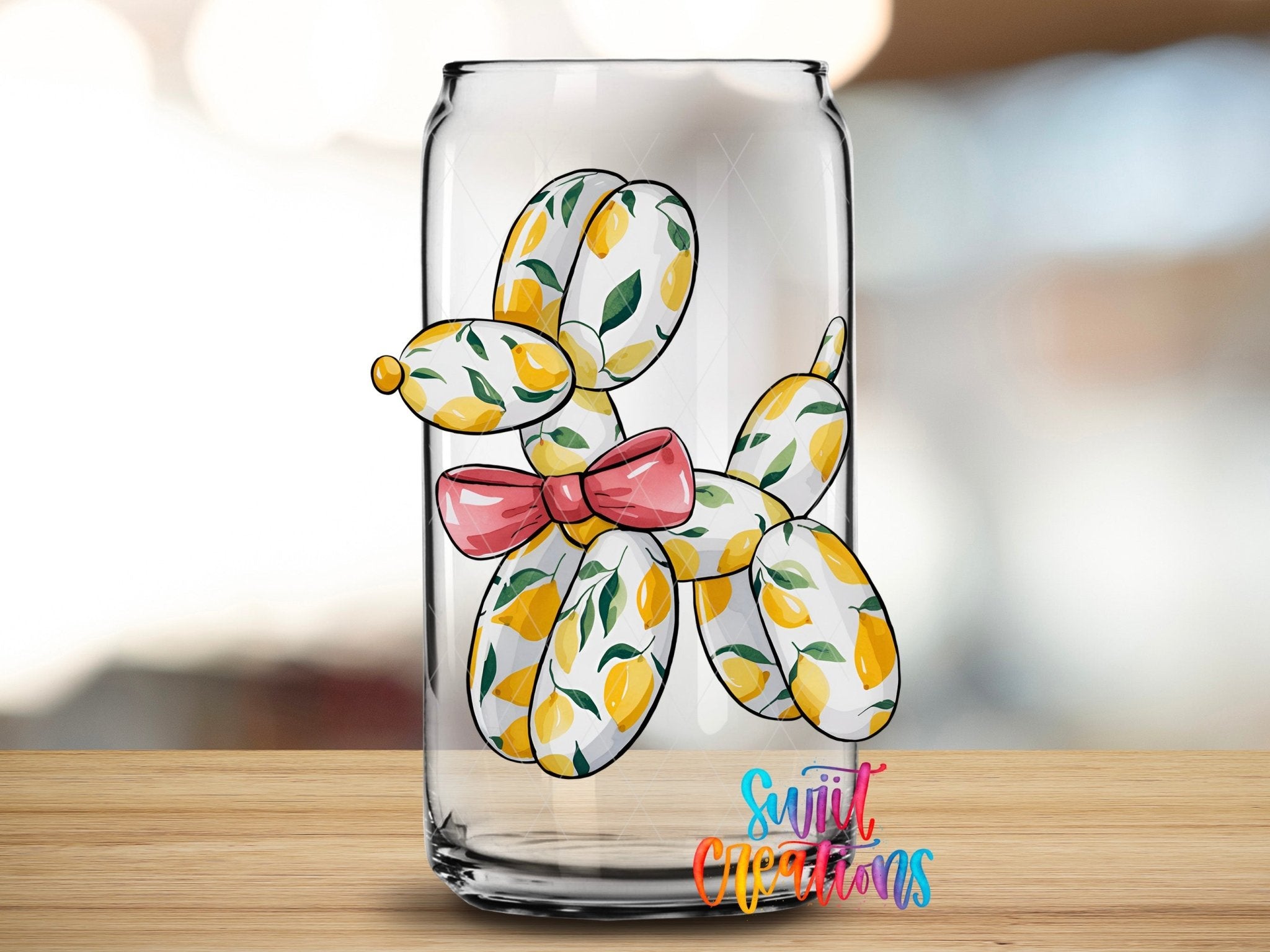 Lemon Balloon Dog UV DTF transfer applied to a clear glass can from Swiit Creations