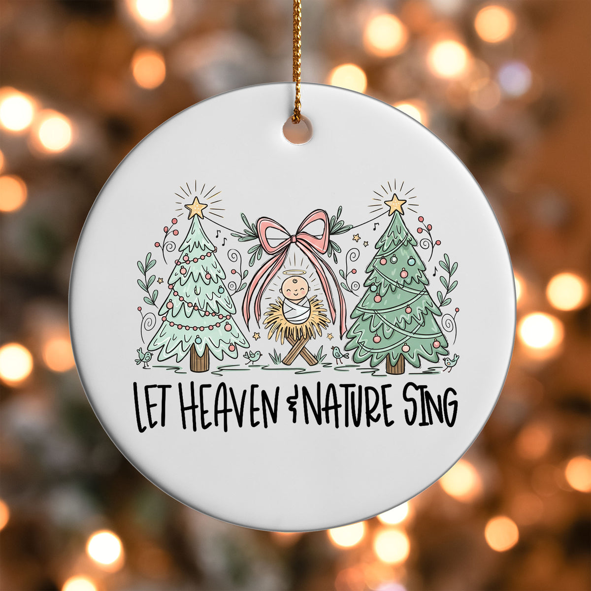 Let Heaven and Nature Sing ornament UV DTF transfer on a round white ornament with a bokeh light background