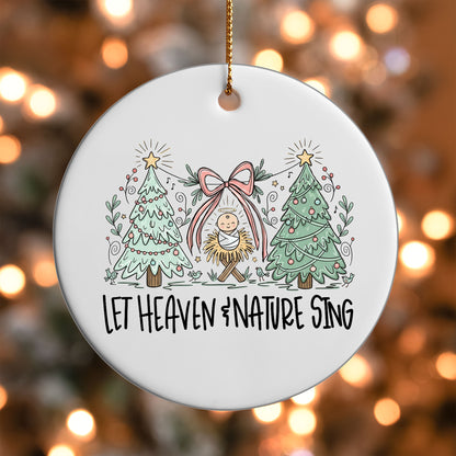 Let Heaven and Nature Sing ornament UV DTF transfer on a round white ornament with a bokeh light background