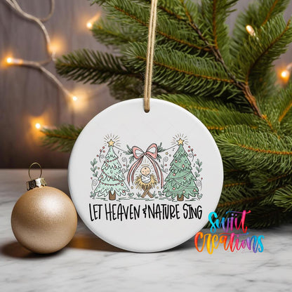 Let Heaven and Nature Sing ornament UV DTF transfer on a hanging ornament with pine branches and a gold bauble