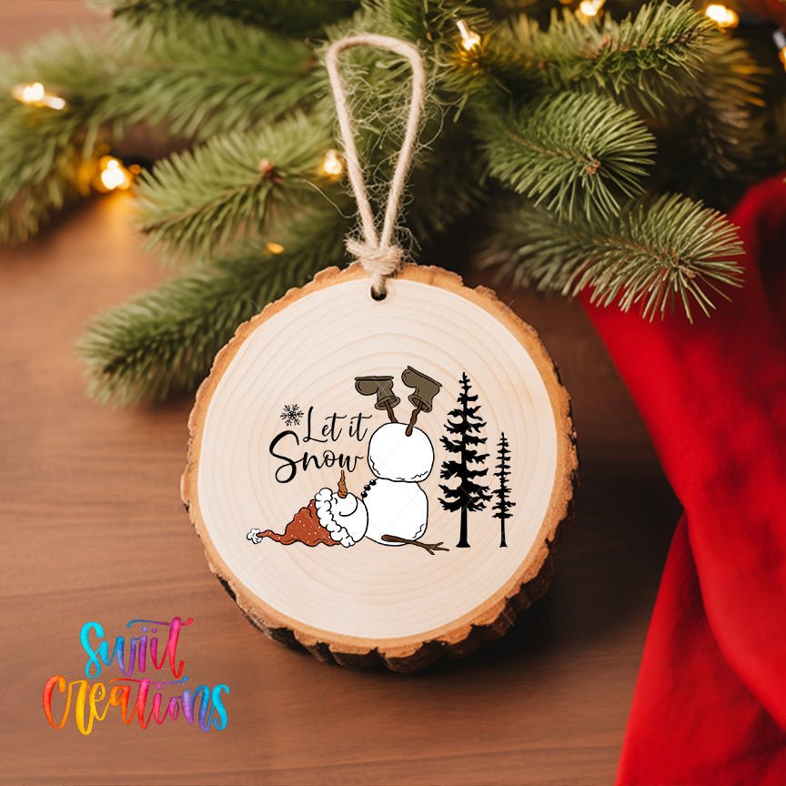 Let It Snow Snowman UV DTF transfer on a wood slice ornament with pine branches and a red stocking